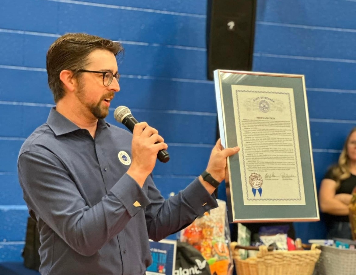 Blayne Osborn presenting a proclamation