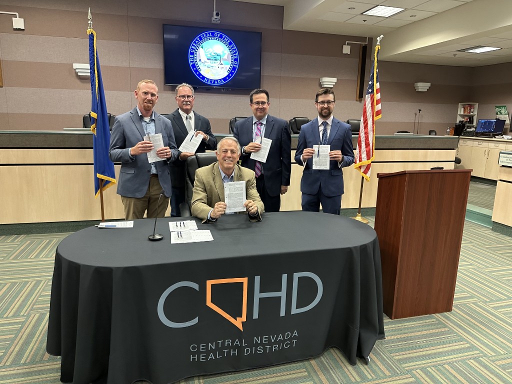 Blayne Osborn with Governor Lombardo at bill signing